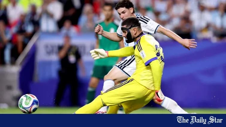 Goalkeeper attempting to clear the ball during match