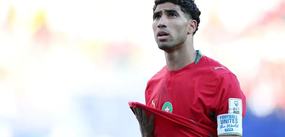 Morocco player adjusting jersey during match