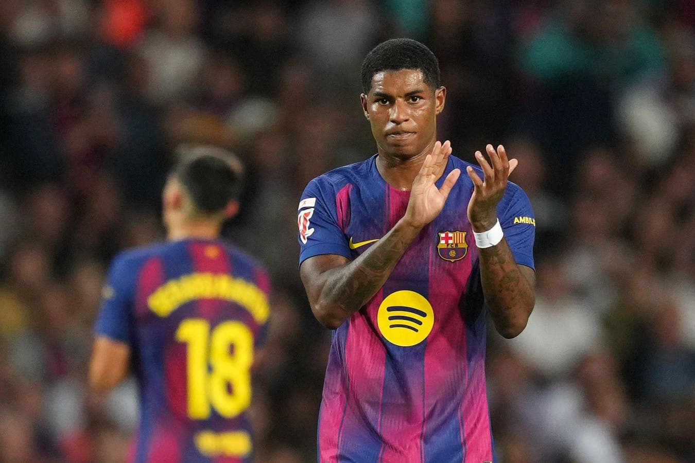Barcelona player applauding during match celebration