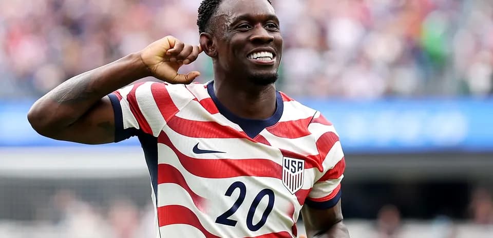 Player celebrating in USA jersey after scoring
