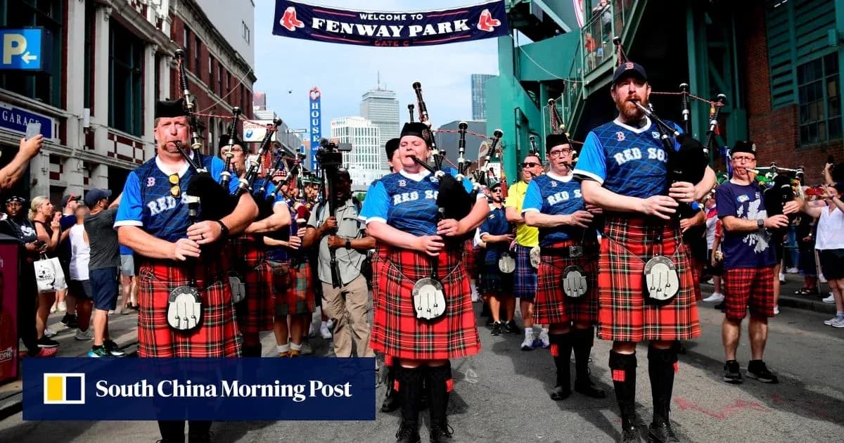 Bagpipers in kilts marching at Fenway Park