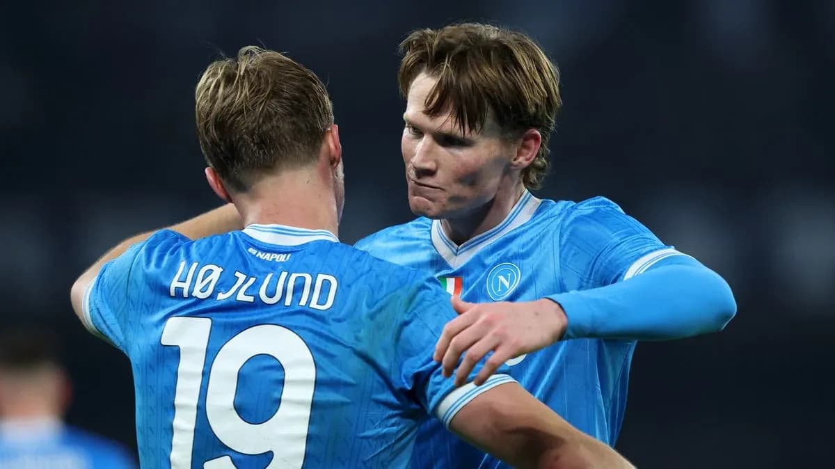 Two Napoli players embracing during a match