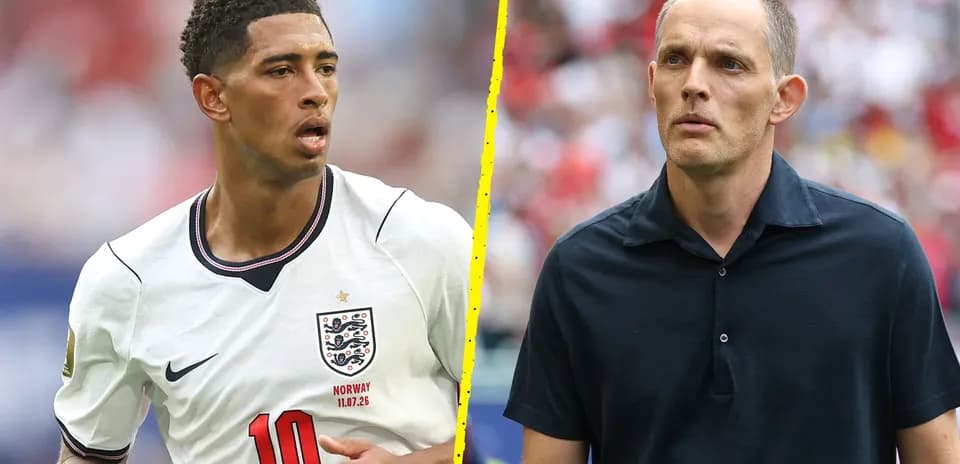 Football player in England kit and coach on sidelines