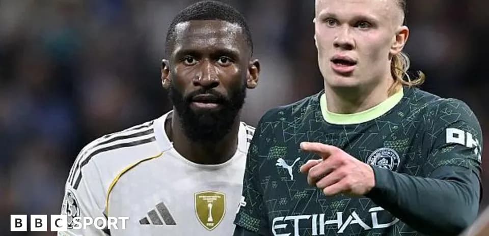 Two football players in intense discussion on pitch