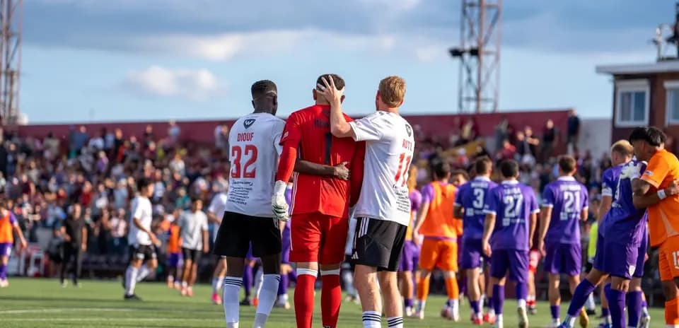 Players interacting after USL League One match