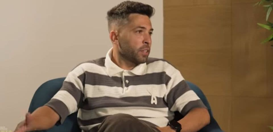 Person speaking during an interview while seated