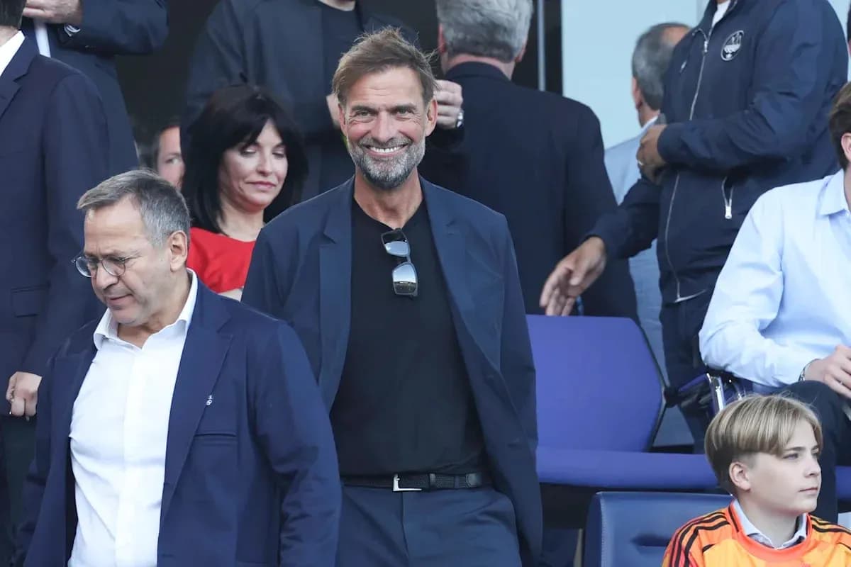 Two men walking in a stadium seating area