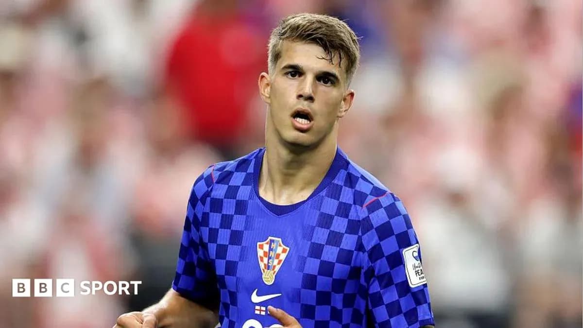 Player in blue Croatia kit during match