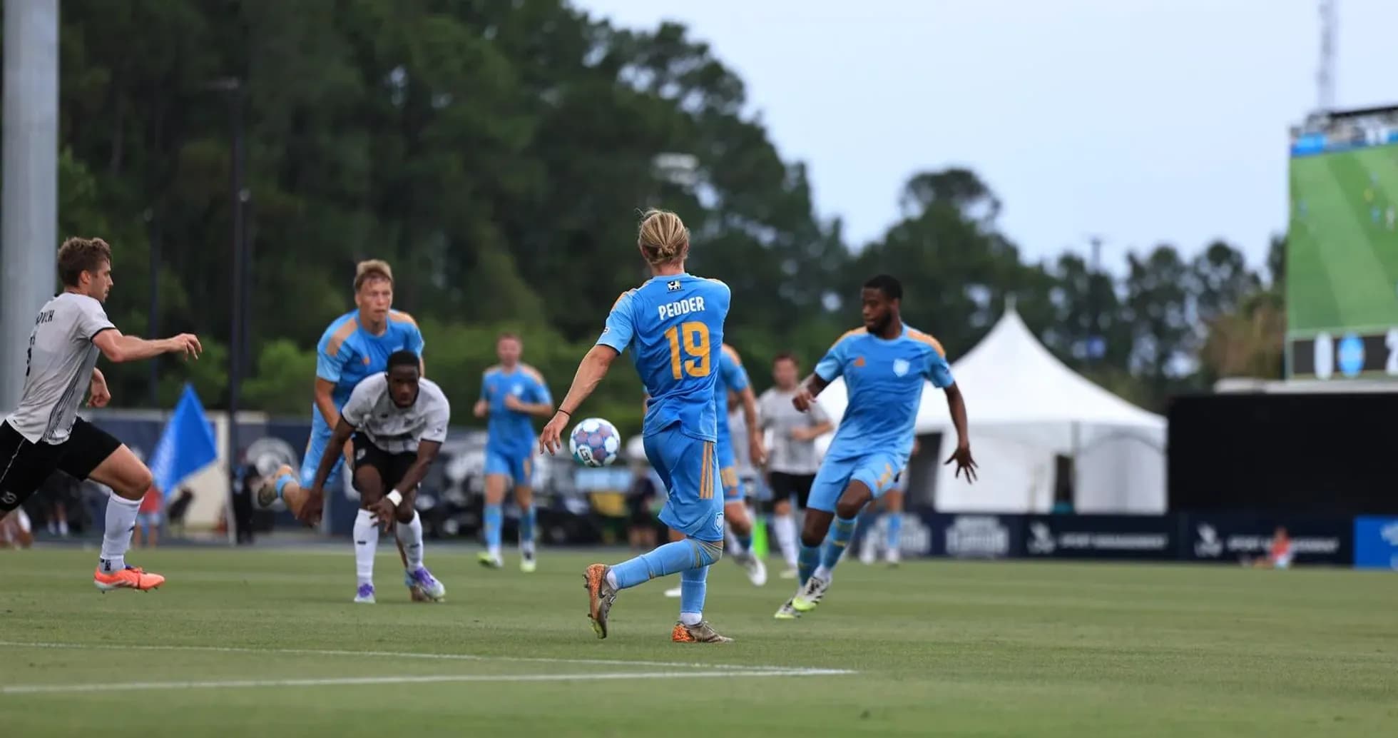 Player passing ball during Sporting JAX match