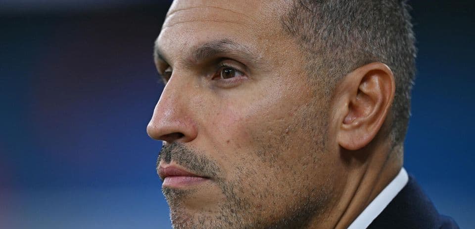 Profile of a man with short hair and stubble