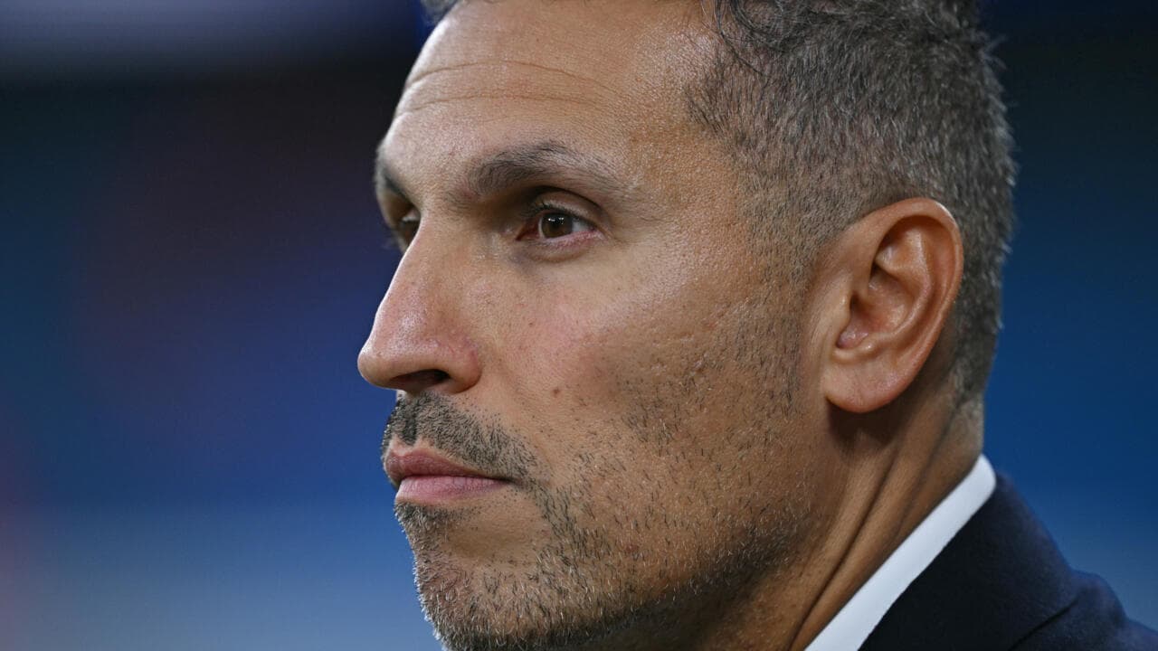 Profile of a man with short hair and stubble