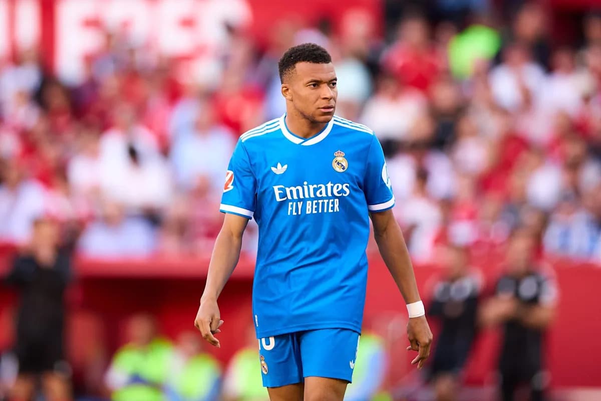 Player wearing blue Real Madrid kit on the field