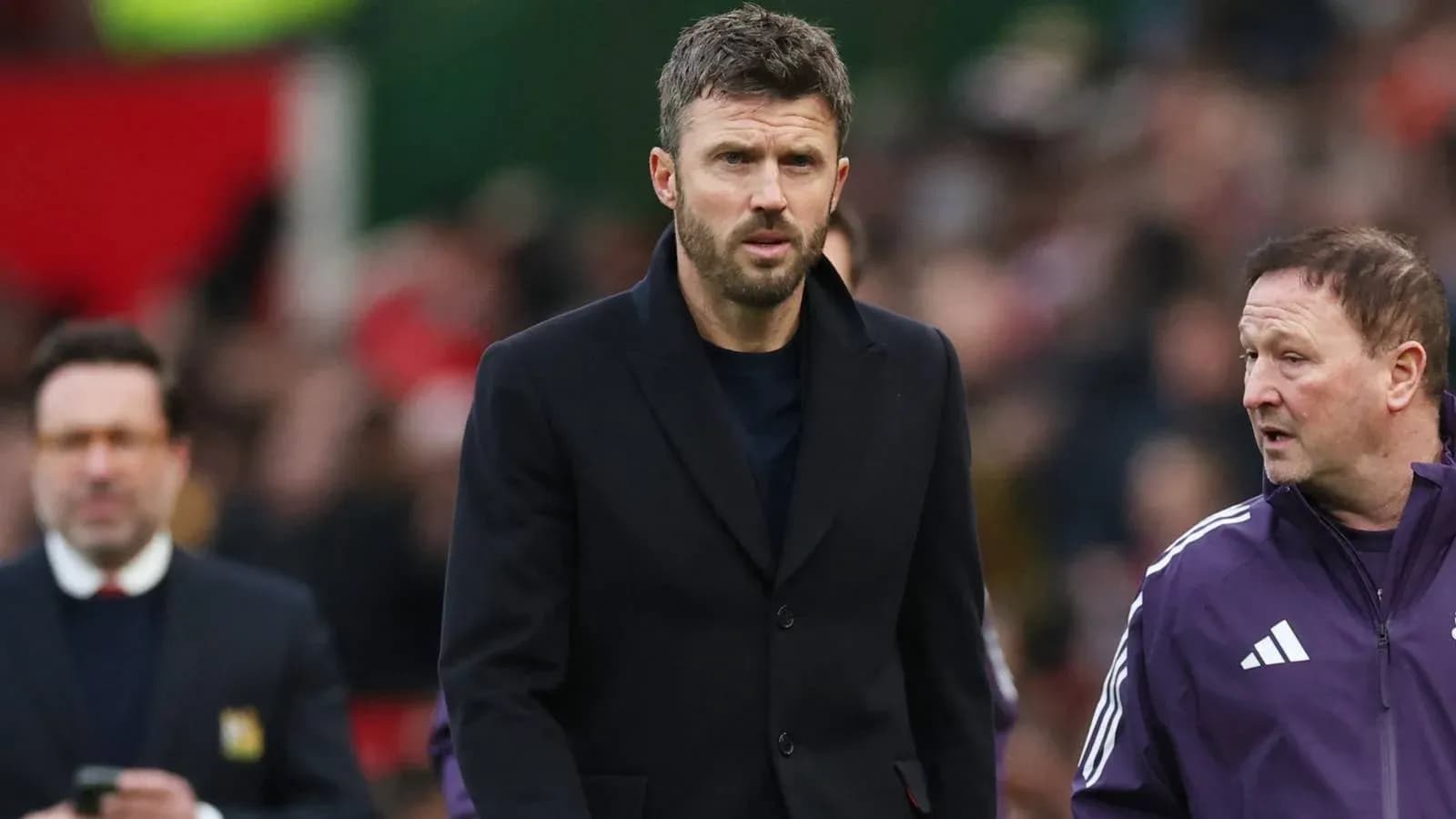 Coaches walking on the sidelines during a match