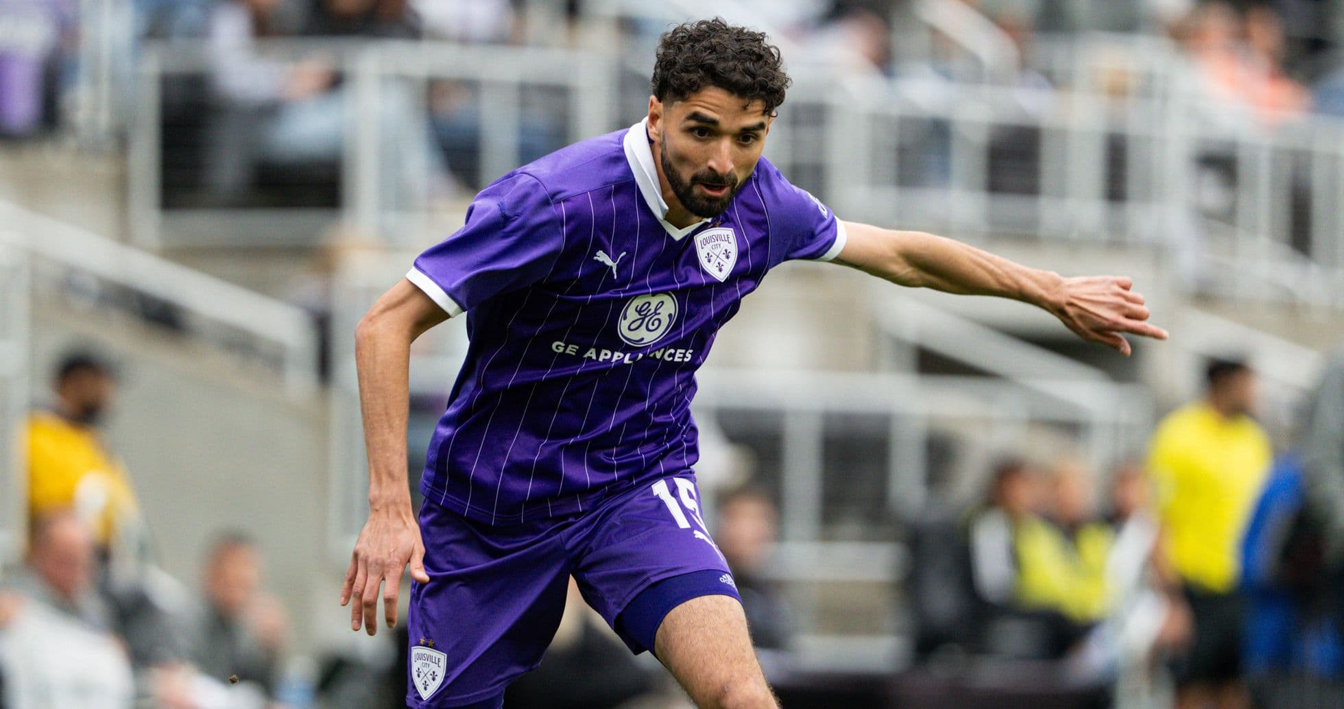 Louisville City player in action during match