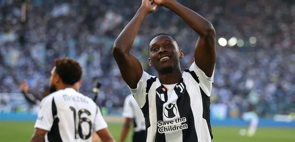 Player celebrating in front of cheering crowd