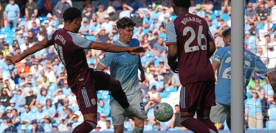 Players contesting the ball in Premier League match