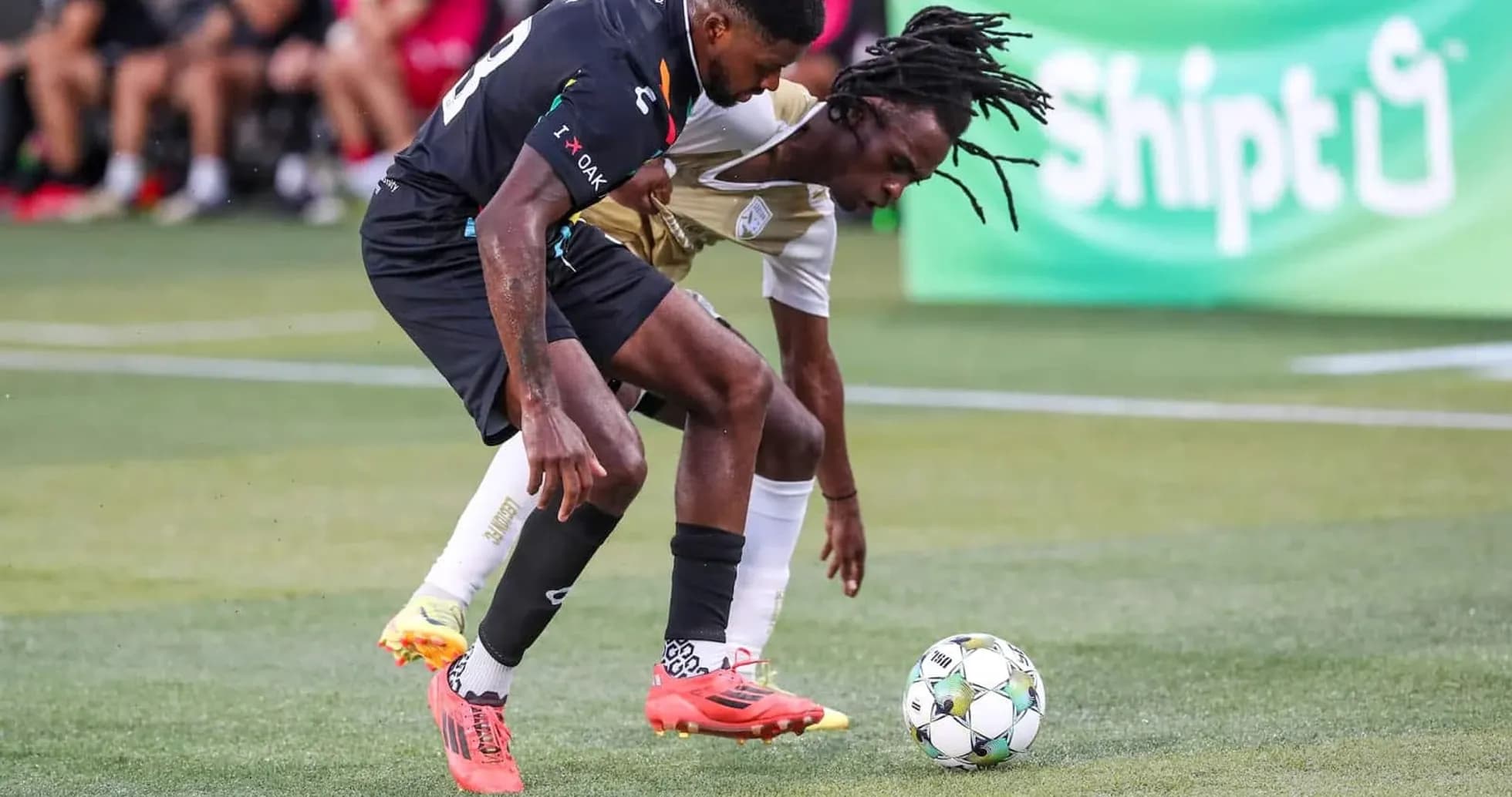 Players contesting for the ball during match