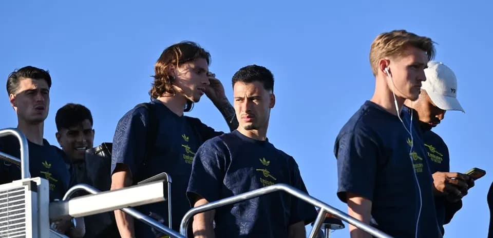 Group of players walking down steps outdoors