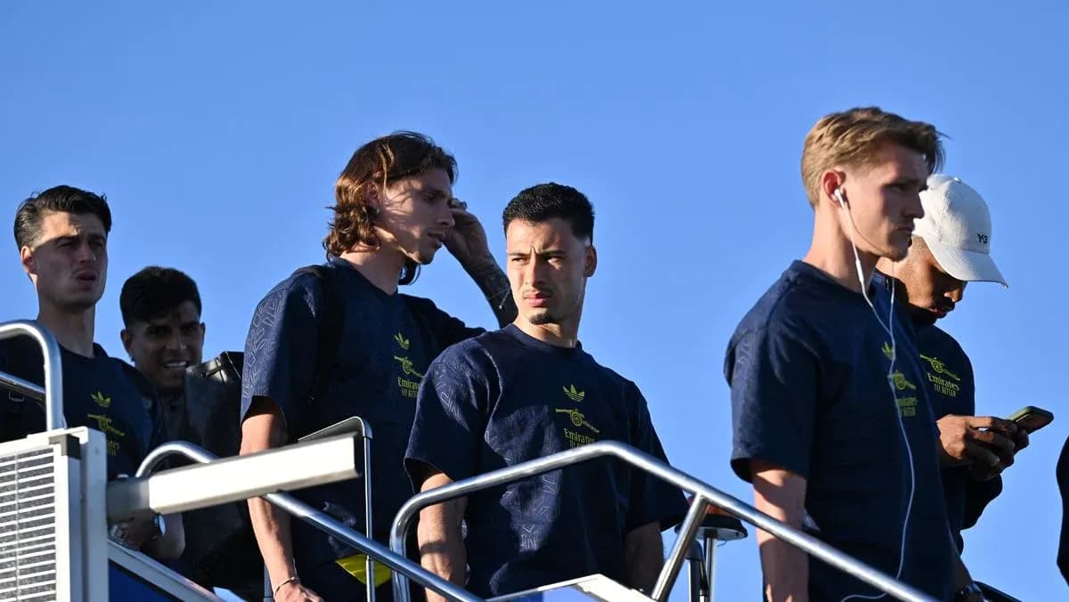 Group of players walking down steps outdoors