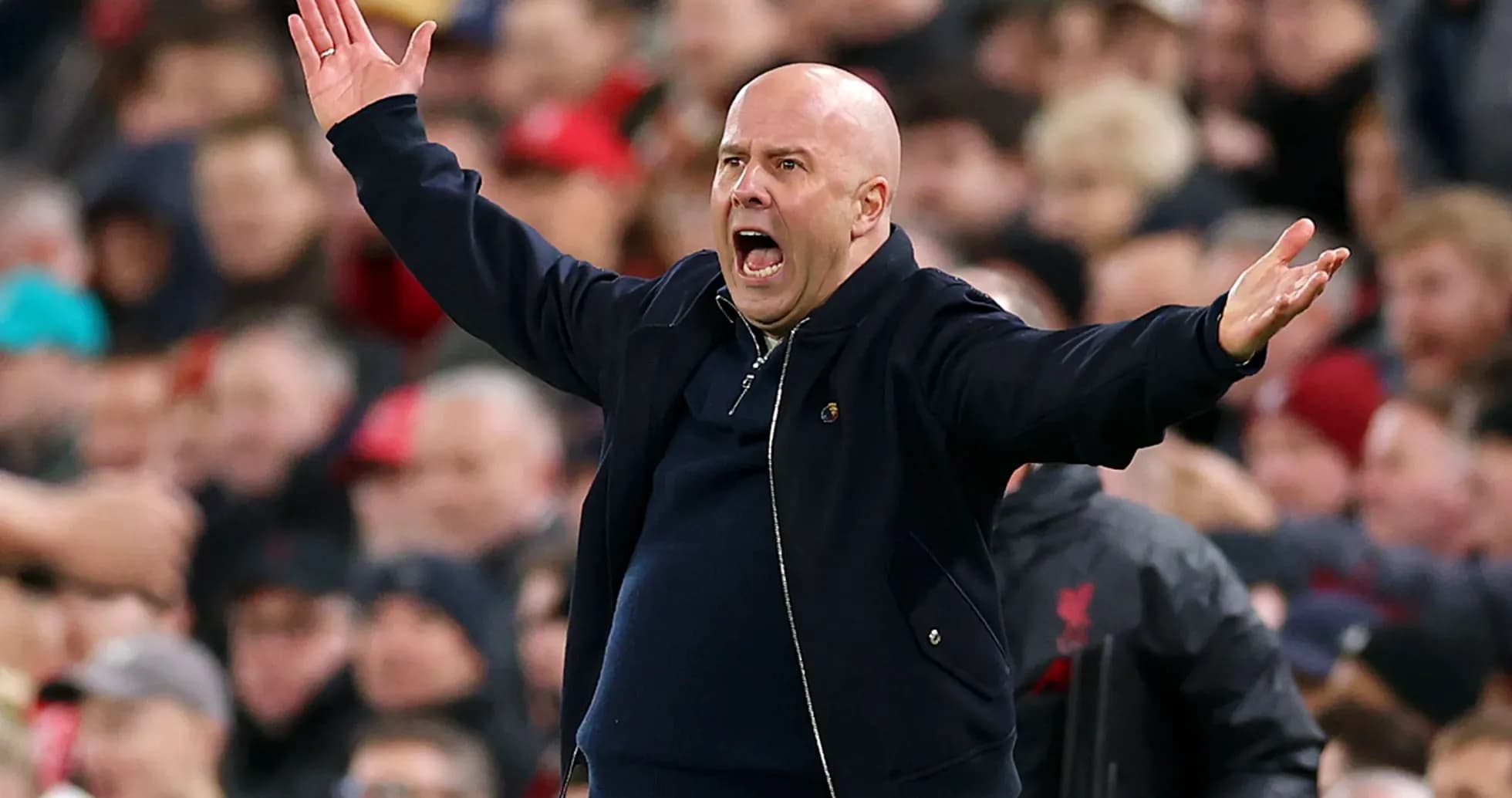 Coach gesturing animatedly on the sidelines during match