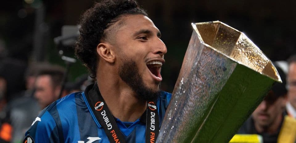 Player celebrating with trophy after final match