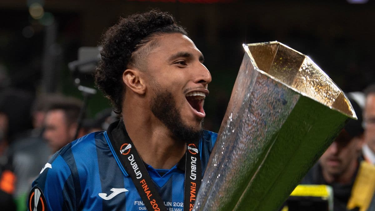 Player celebrating with trophy after final match