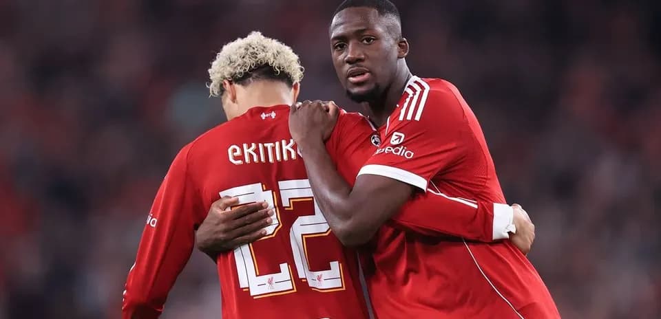 Two players embracing on the field during match