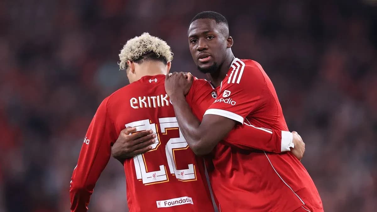 Two players embracing on the field during match