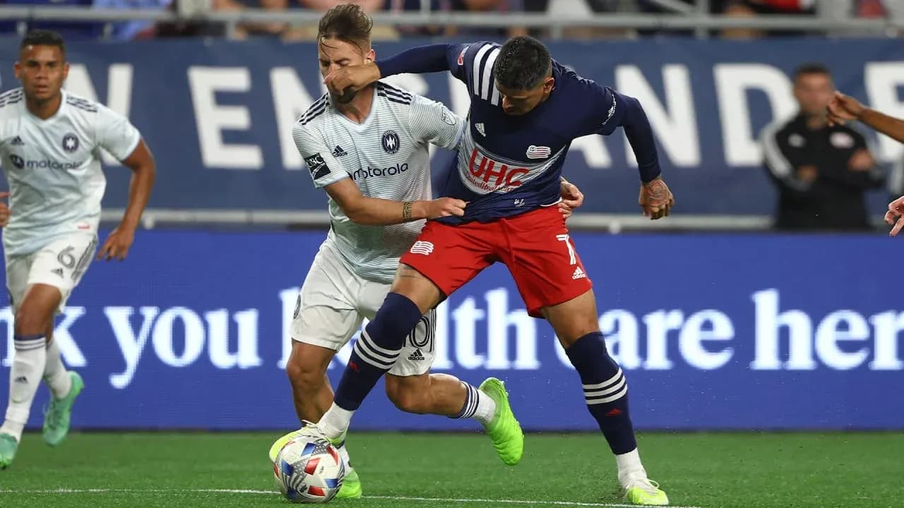 Players competing for the ball in MLS Next Pro match