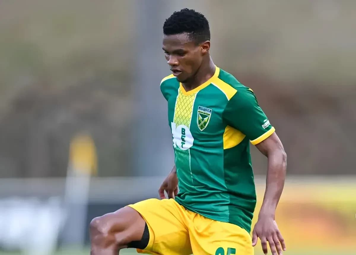 Player in green and yellow uniform during training
