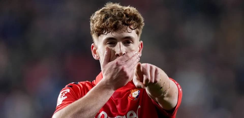 Player celebrating and pointing towards the crowd