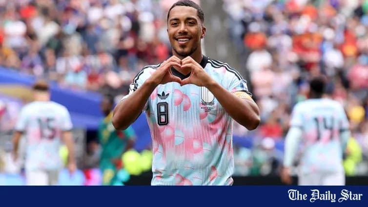 Player making heart gesture after scoring goal