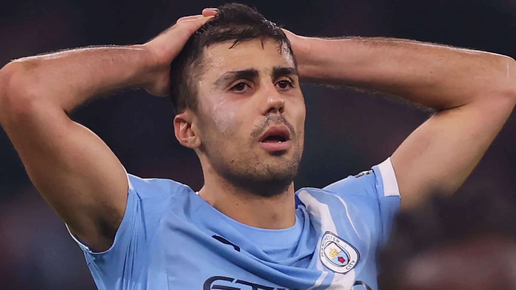 Player holding head in disappointment during match