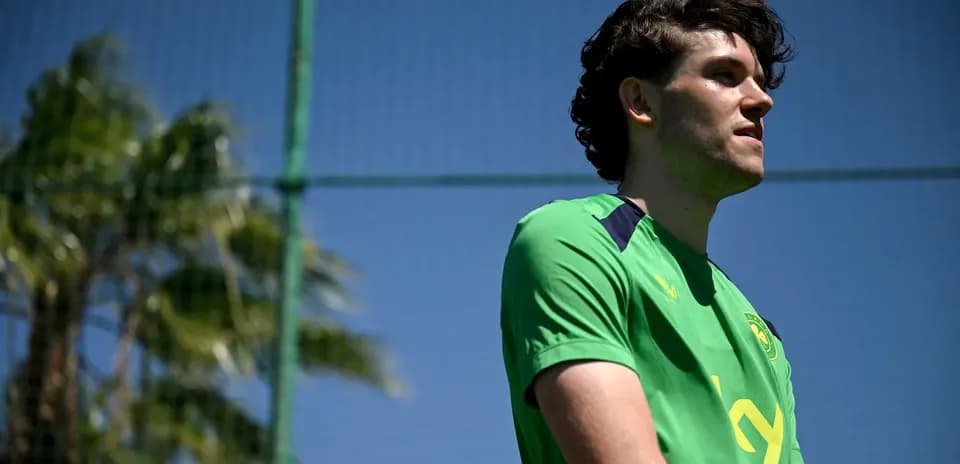 Player in green training kit at football practice