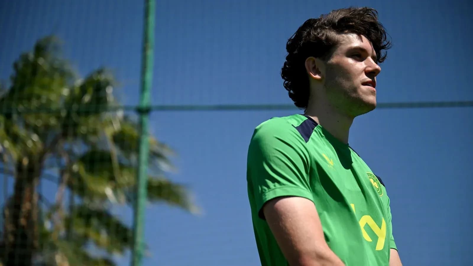 Player in green training kit at football practice