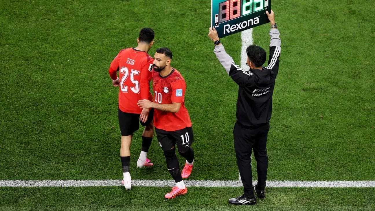 Egyptian players preparing for substitution during match