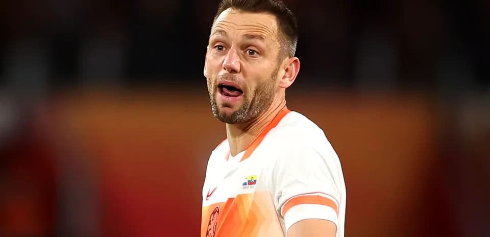 Player in Dutch kit reacting during a match