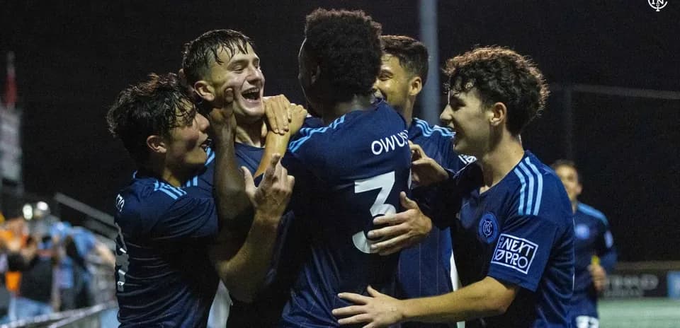Players celebrating a goal for New York City II