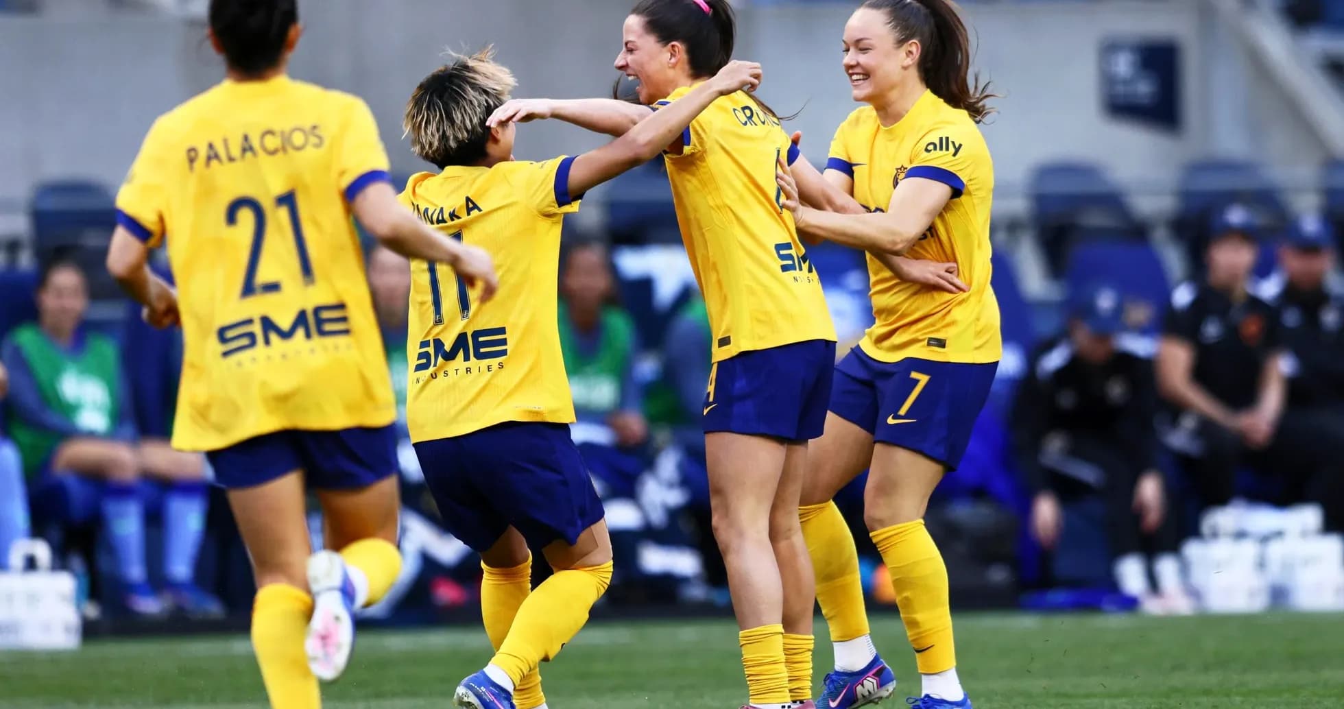 Celebrating players in yellow jerseys during match