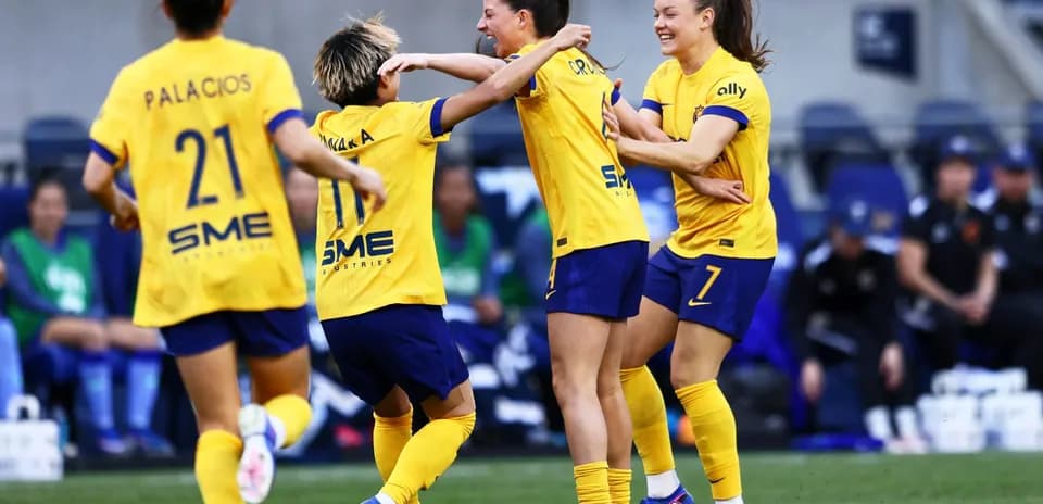 Celebrating players in yellow jerseys during match