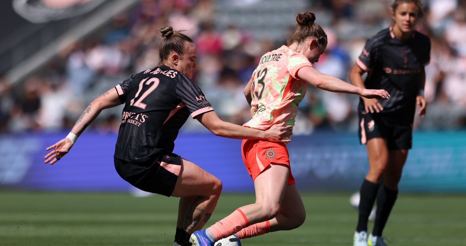 Portland Thorns W player tackling Utah Royals W opponent
