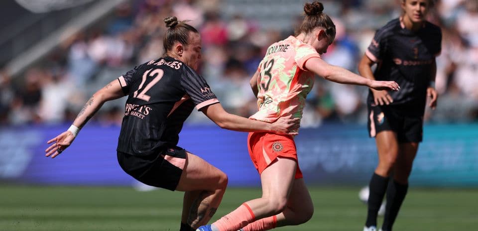 Portland Thorns W player tackling Utah Royals W opponent