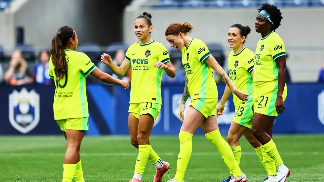 Players celebrating during NWSL match