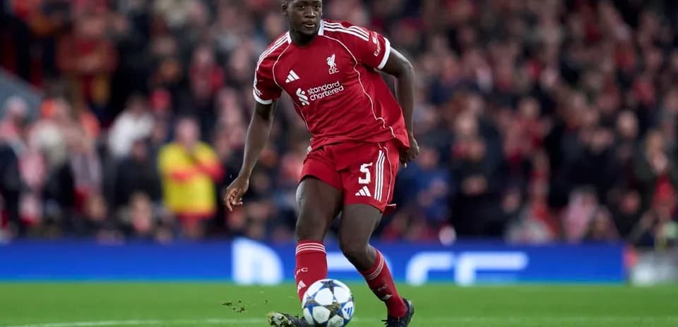Liverpool player dribbling ball during match