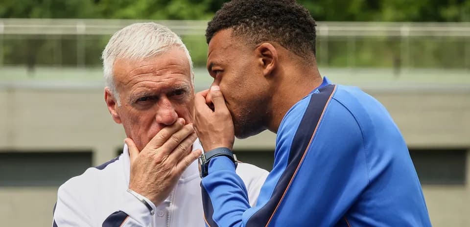 Coach and player discussing strategy during training
