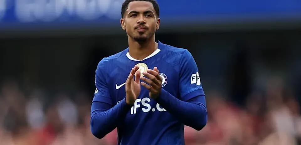 Player applauding fans in blue jersey