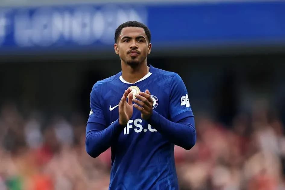 Player applauding fans in blue jersey