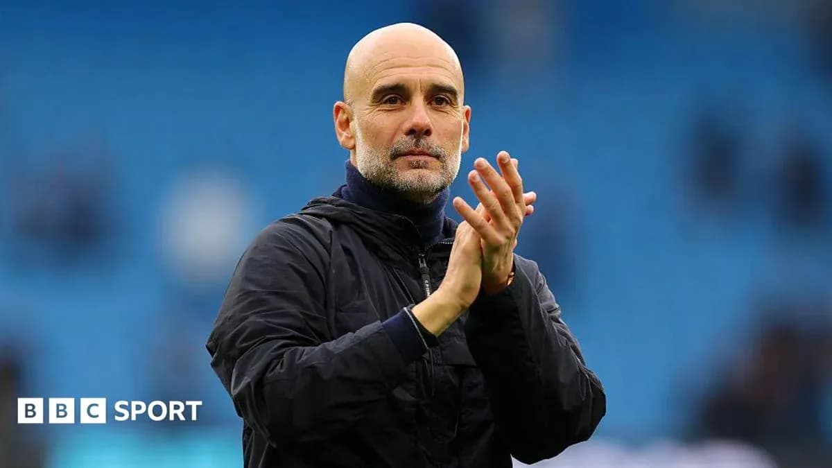 Coach applauding during match at stadium