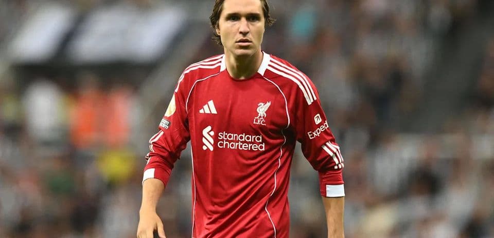 Player in red Liverpool kit on the pitch