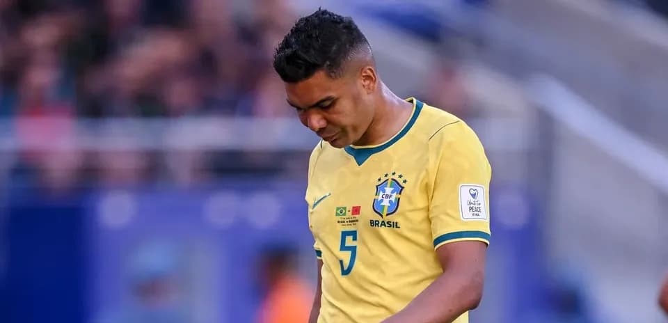 Brazilian player walking with head down during match